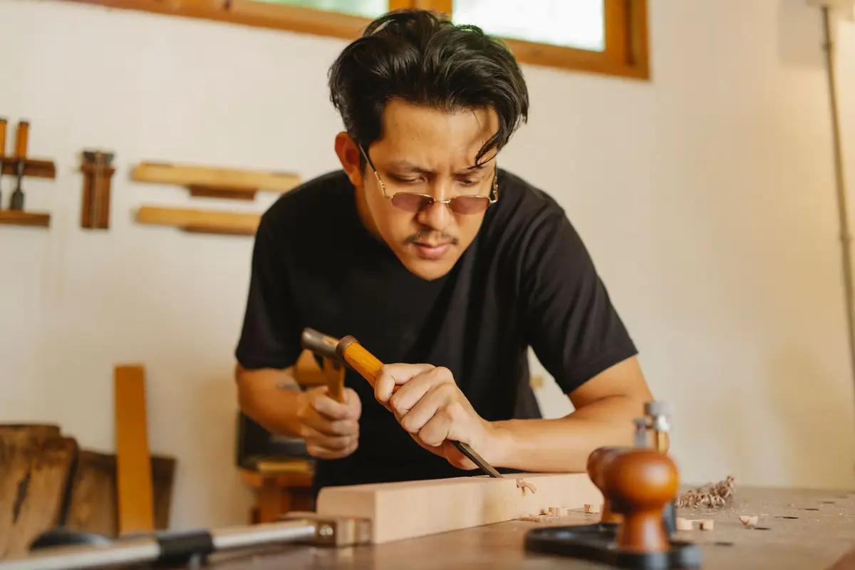 Craftsman fitting wood flooring in Kyle, TX